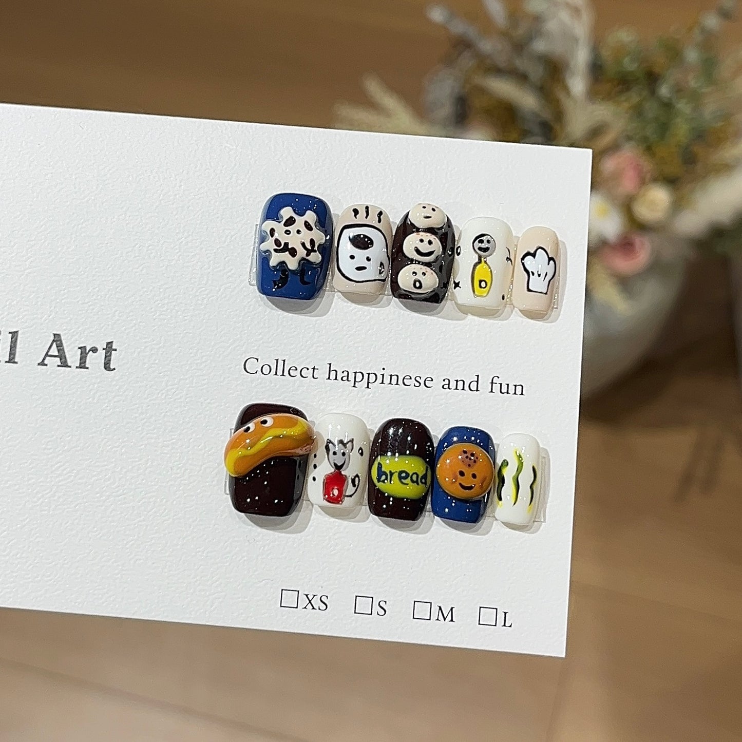 Sweet imp press-on nails with cute playful character-inspired nail art