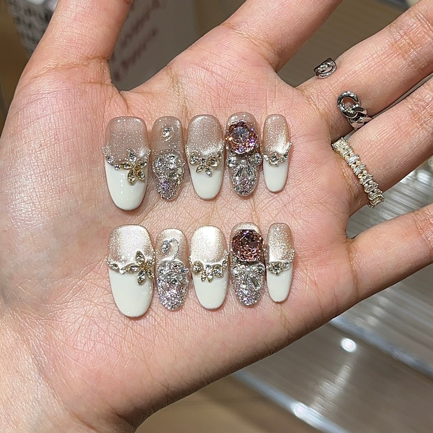 Creamy rose press-on nails with soft pink rose-inspired details
