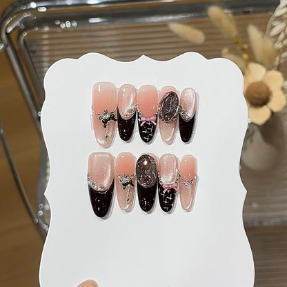 Black pink press-on nails with bold contrast and stylish nail art
