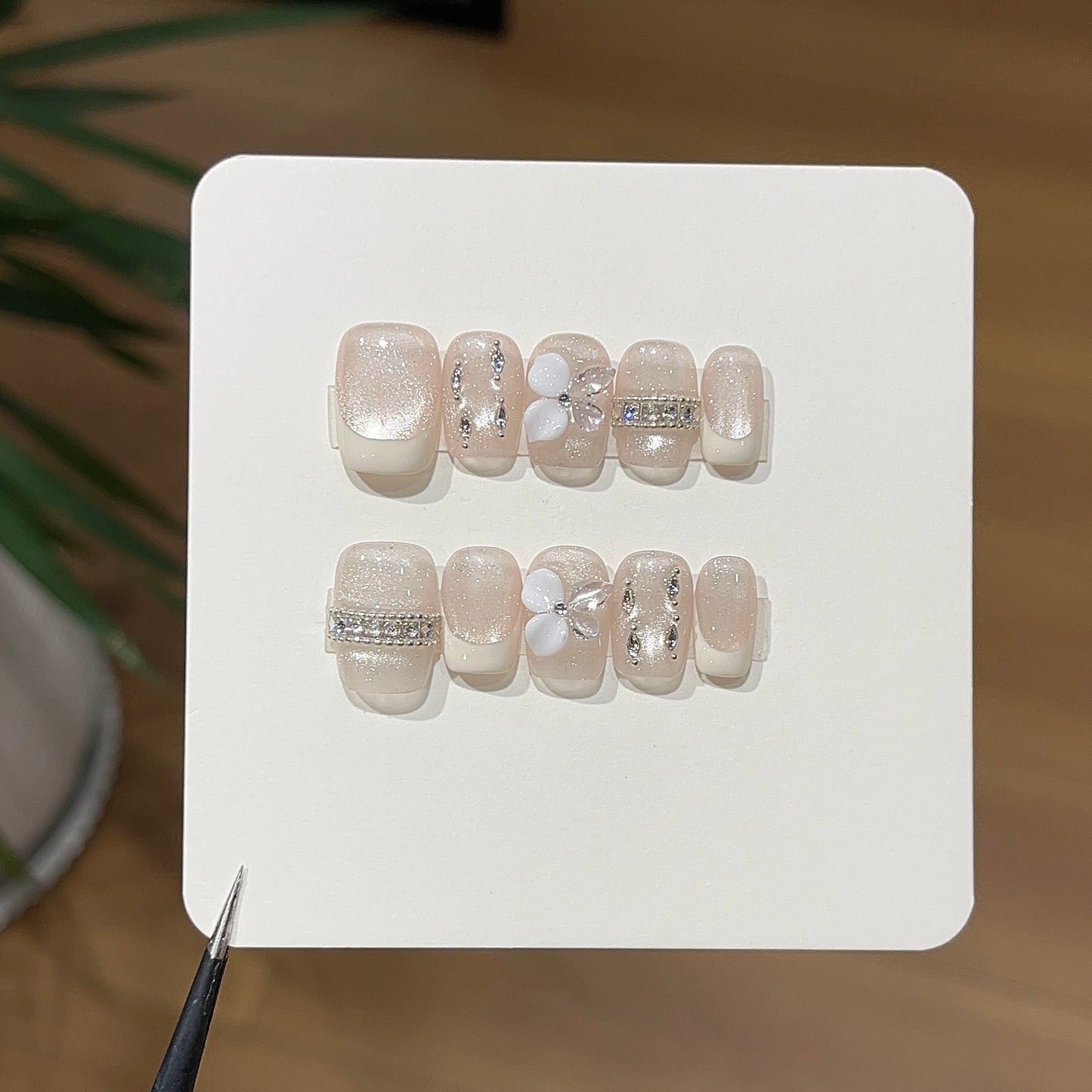 Ivory luna butterfly press-on nails with delicate butterfly details
