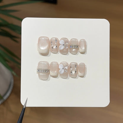 Ivory luna butterfly press-on nails with delicate butterfly details
